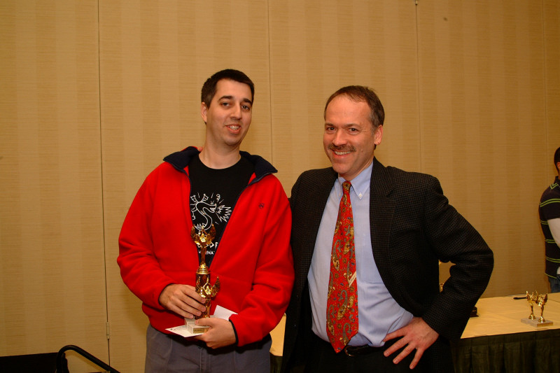 Trip Payne receiving trophies from Will Shortz