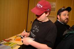 Tyler Hinman signs an autograph Tyler Hinman signs an autograph