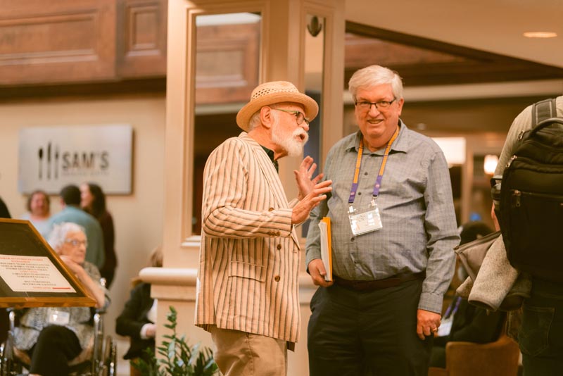 Mike Alpern and Al Sanders catch up before the CRU dinner